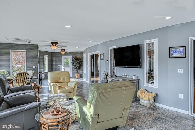 living area with visible vents, baseboards, ceiling fan, and recessed lighting