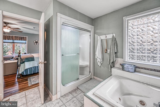 ensuite bathroom with a stall shower, ceiling fan, ensuite bath, a whirlpool tub, and tile patterned floors