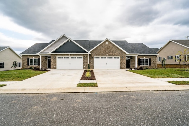 craftsman-style house featuring a garage and a front lawn