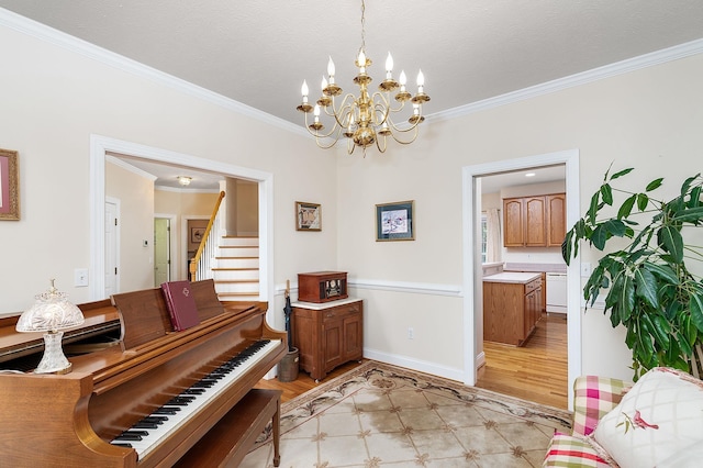living area featuring crown molding, an inviting chandelier, light wood finished floors, stairs, and baseboards