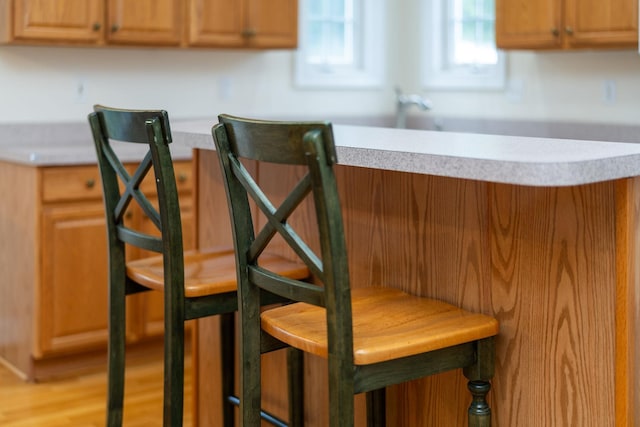 kitchen with light wood-style floors and light countertops
