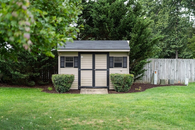 view of shed with fence