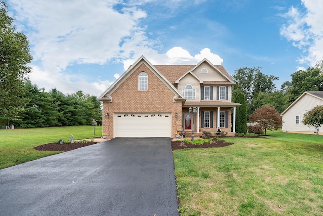 traditional home featuring a front lawn, aphalt driveway, brick siding, an attached garage, and a porch