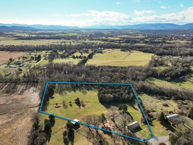 bird's eye view featuring a mountain view and a rural view