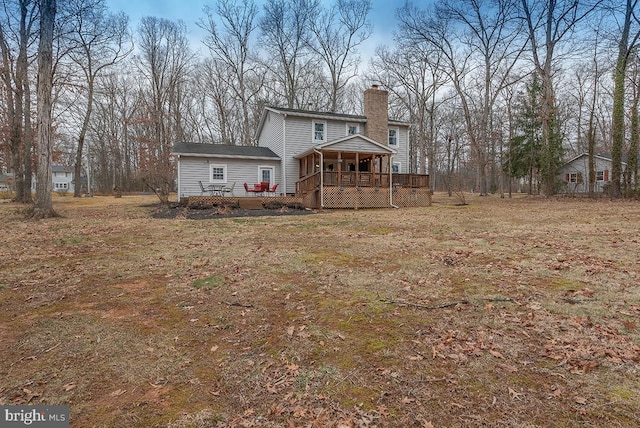 exterior space featuring a deck and a chimney