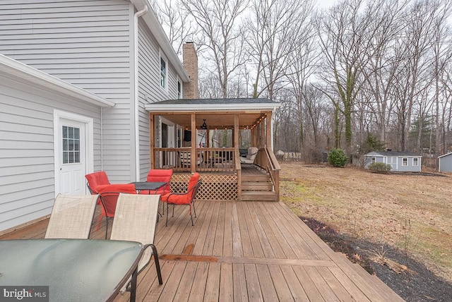 deck featuring an outdoor structure