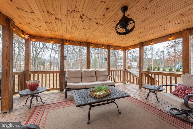 sunroom / solarium featuring wooden ceiling