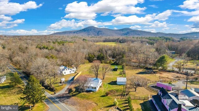 drone / aerial view featuring a mountain view