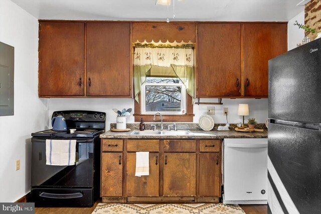 kitchen with sink and black appliances