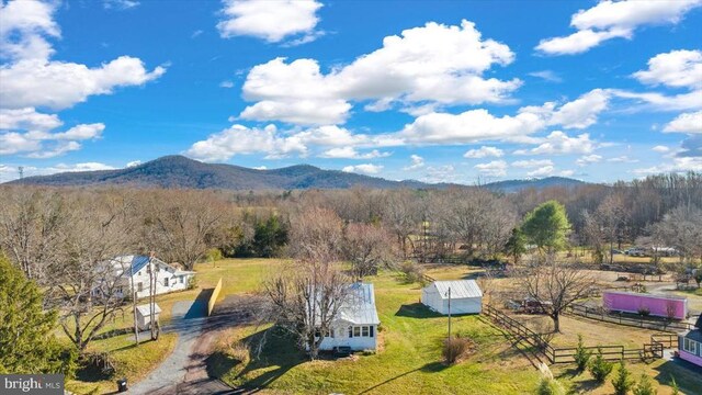 birds eye view of property with a mountain view