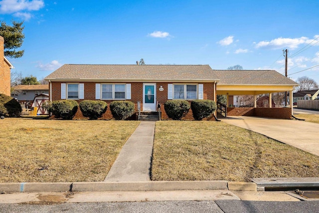 single story home with a front yard and a carport