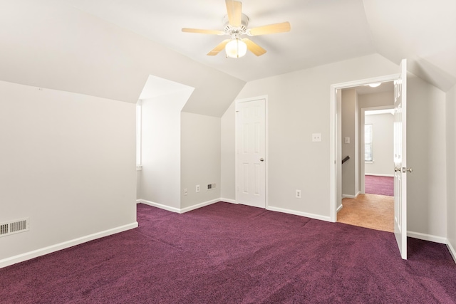 bonus room with ceiling fan, vaulted ceiling, and carpet