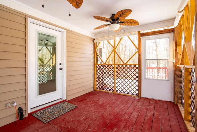 interior space with ceiling fan