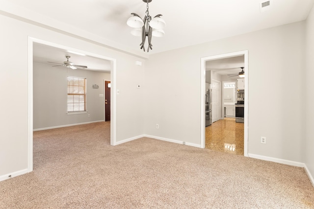 carpeted empty room with ceiling fan