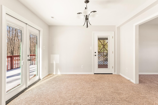 unfurnished room with french doors and carpet