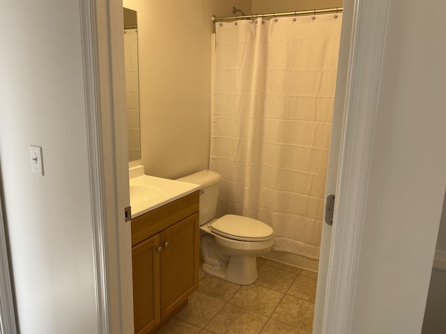 full bathroom featuring vanity and toilet