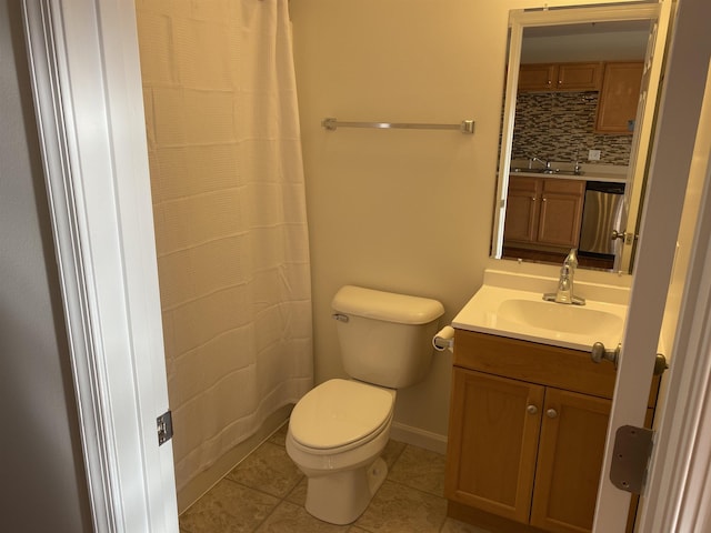 bathroom featuring vanity, baseboards, tile patterned floors, toilet, and tasteful backsplash