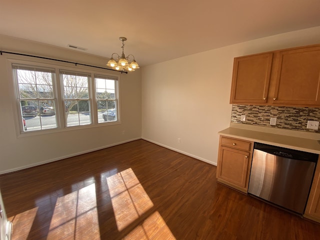 unfurnished dining area with visible vents, baseboards, dark wood-type flooring, and a notable chandelier