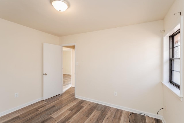 empty room featuring hardwood / wood-style flooring