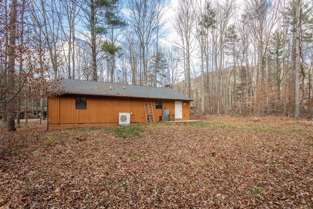 view of side of property with ac unit