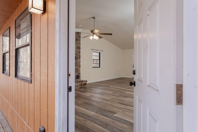 bonus room featuring wood-type flooring, ceiling fan, and vaulted ceiling