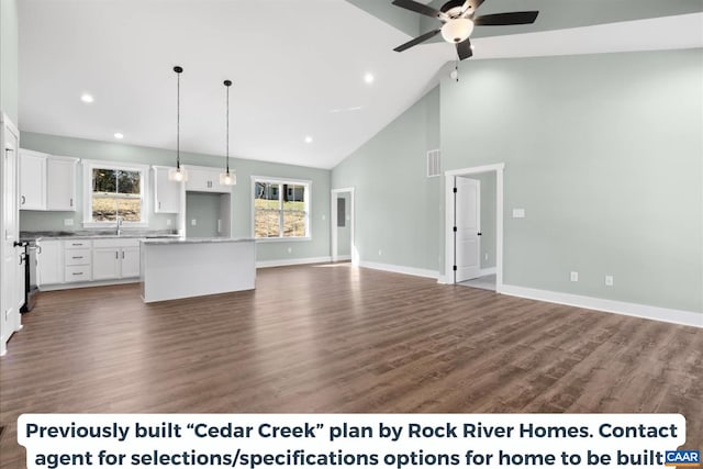 unfurnished living room featuring sink, high vaulted ceiling, and dark hardwood / wood-style floors