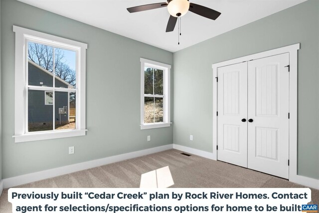 unfurnished bedroom featuring light carpet, a closet, and ceiling fan