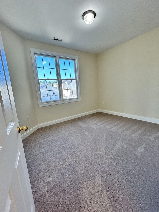 spare room featuring carpet flooring