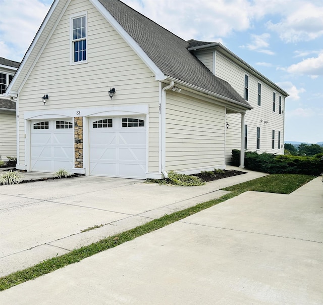 view of property exterior with a garage