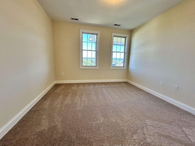 unfurnished room with carpet flooring