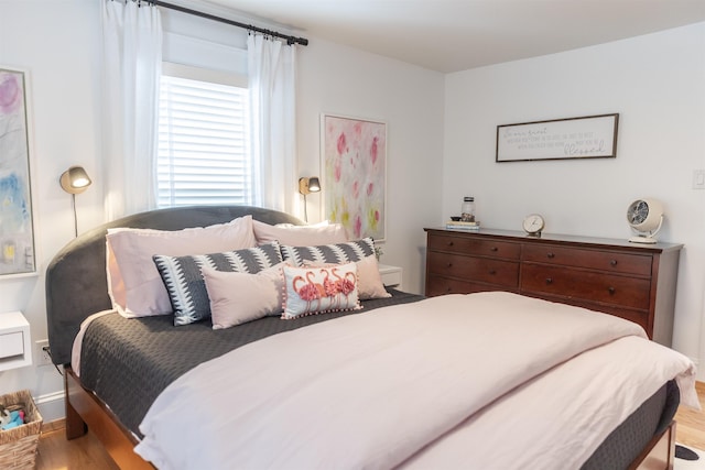 bedroom with light wood-type flooring