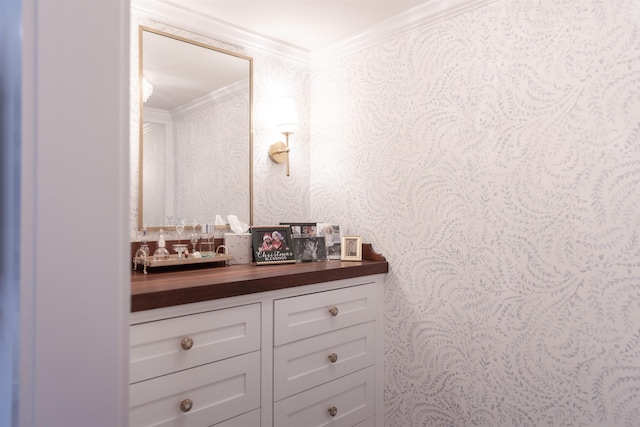 bathroom featuring vanity and ornamental molding