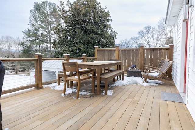 view of snow covered deck