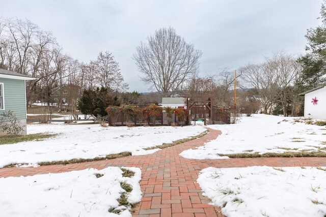 view of yard layered in snow