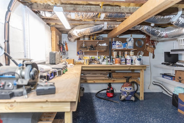 basement with a workshop area