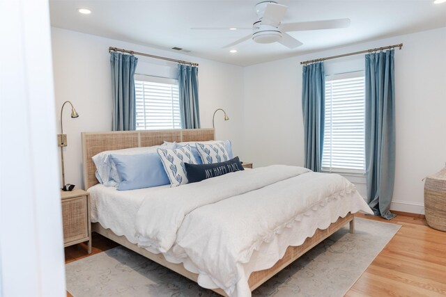 bedroom with ceiling fan and wood-type flooring