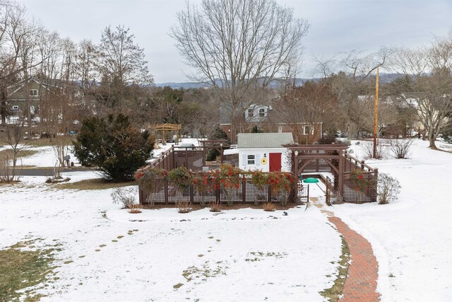 view of yard layered in snow