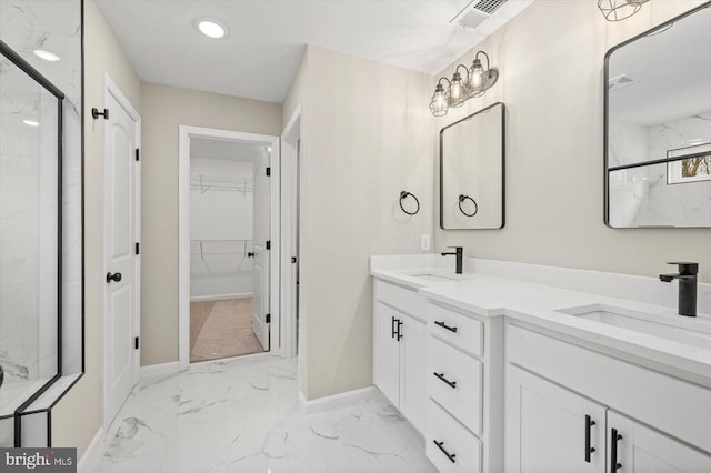 bathroom with marble finish floors, baseboards, a marble finish shower, a walk in closet, and recessed lighting