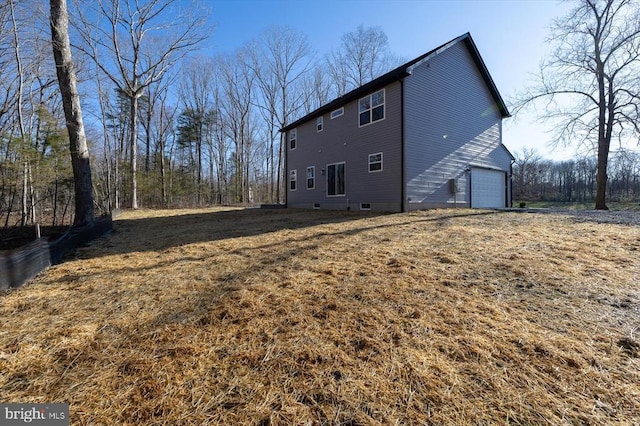 back of house with a garage