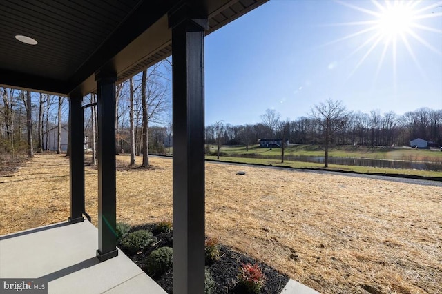 view of yard with a water view and view of scattered trees