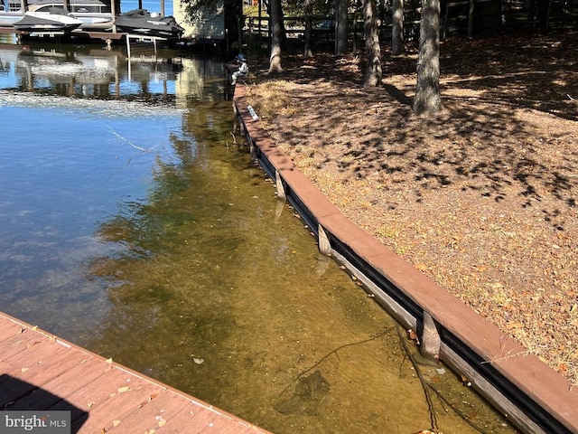view of dock with a water view