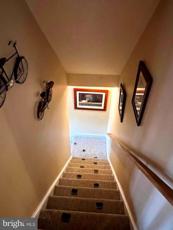 staircase featuring baseboards