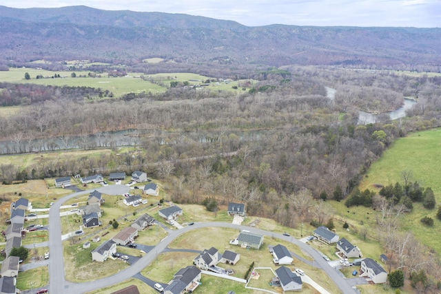 aerial view with a mountain view, a forest view, and a residential view