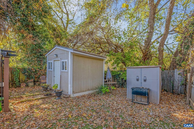 view of shed with a fenced backyard