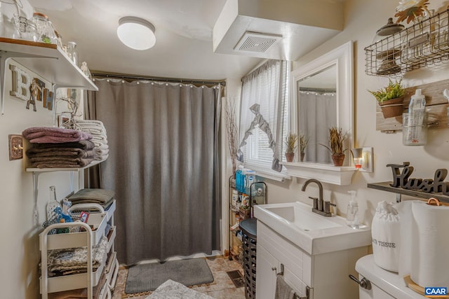 full bathroom with visible vents, vanity, and a shower with curtain