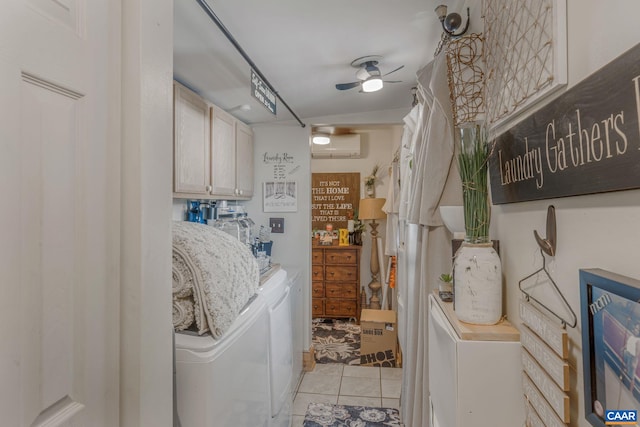 washroom featuring separate washer and dryer, cabinet space, light tile patterned floors, and a wall unit AC