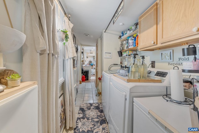 325 10 1/2 St NW, Charlottesville, VA 22903 - laundry room with separate washer and dryer, cabinet space, and light tile patterned floors