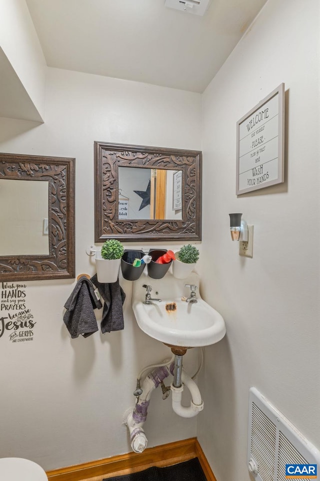 325 10 1/2 St NW, Charlottesville, VA 22903 - half bathroom with a sink