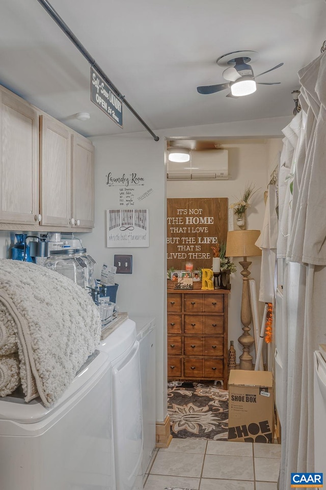 laundry room with a ceiling fan, separate washer and dryer, a wall unit AC, and light tile patterned floors