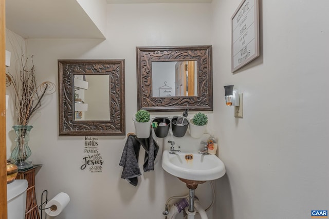 half bath featuring toilet